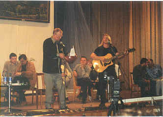Ray McNiece and Yevgeny on stage performing in Siberia